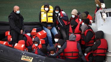 Migrants are brought into the Port of Dover onboard a Border Force vessel after being rescued while crossing the English Channel, in Dover, Britain, March 15, 2022. (Reuters)