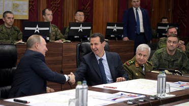 Russian President Vladimir Putin shakes hands with Syria's President Bashar al-Assad in Damascus, Jan. 7, 2020. (Reuters)