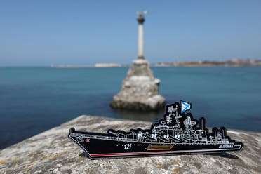 A magnet depicting the Russian missile cruiser Moskva, which sank in the Black Sea, is pictured at an embankment in Sevastopol, Crimea, on April 15, 2022. (Reuters)