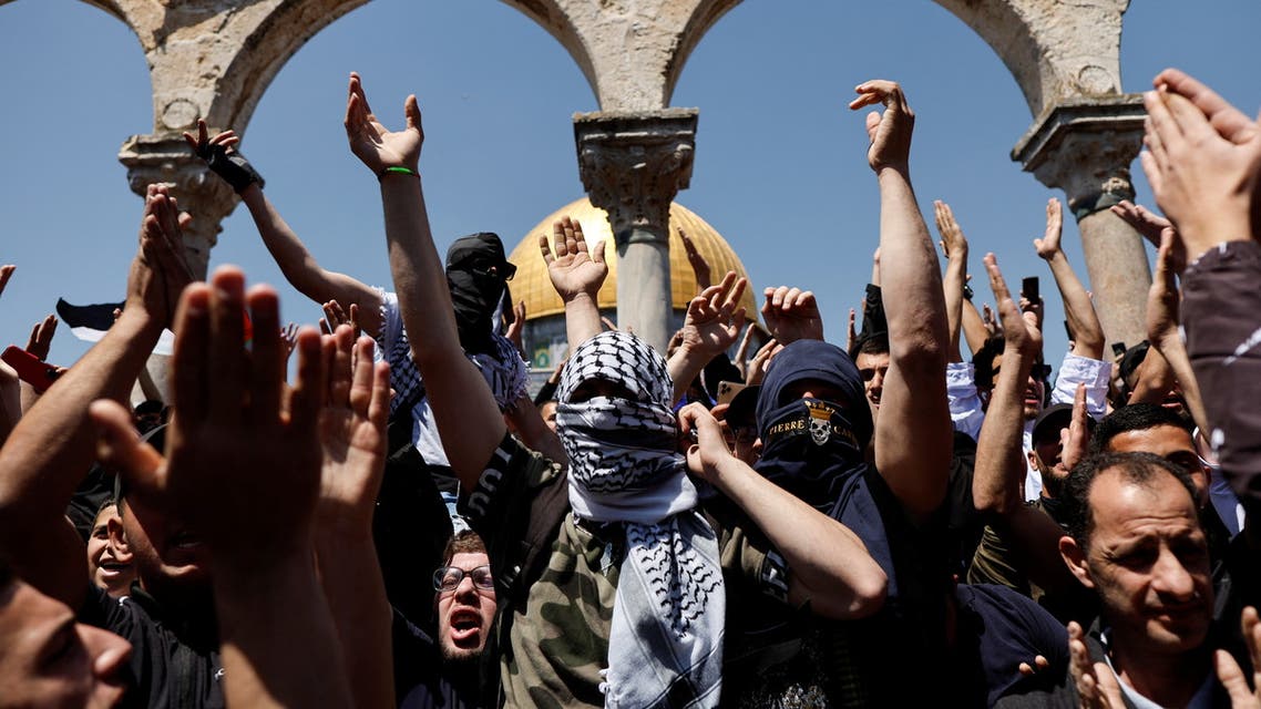 Palestinians shout slogans at the compound that houses Al-Aqsa Mosque, known to Muslims as Noble Sanctuary and to Jews as Temple Mount, following clashes with Israeli security forces in Jerusalem's Old City April 15, 2022. (Reuters)