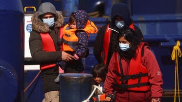 Migrants disembark at the Port of Dover after being rescued while crossing the English Channel, in Dover, Britain, April 15, 2022. REUTERS/Hannah McKay