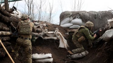 Ukrainian soldiers keep their position in a trench on the front line with Russian troops in Lugansk region on April 11, 2022. (AFP)