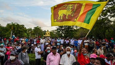 Janatha Vimukthi Peramuna party activists and supporters shout anti-government slogans during a demonstration in Colombo on April 19, 2022, demanding President Gotabaya Rajapaksa’s resignation over the country’s crippling economic crisis. (AFP)