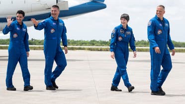 NASA astronauts Jessica Watkins, left, Kjell Lindgren, second from left, ESA (European Space Agency) astronaut Samantha Cristoforetti, second from right, and NASA astronaut Robert Hines, right, are seen as they depart the Launch and Landing Facility at NASA’s Kennedy Space Center after answering questions from members of the media ahead of SpaceX’s Crew-4 mission, Monday, April 18, 2022, in Florida. (AFP)