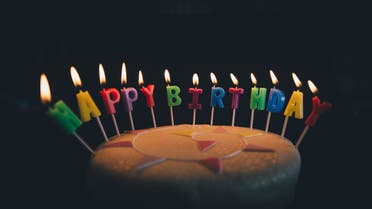 Stock image of a birthday cake with candles. (Unsplash, Annie Spratt)