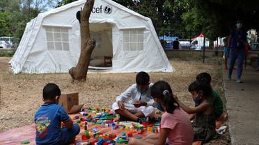 Children play outside a UNICEF tent in Lebanon on August 20, 2020. (Reuters)