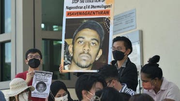 Activists hold posters protesting against the execution of Nagaenthran Dharmalingam, sentenced to death for trafficking heroin into Singapore, outside the Singapore High Commission in Kuala Lumpur on March 9, 2022. (AFP file photo)