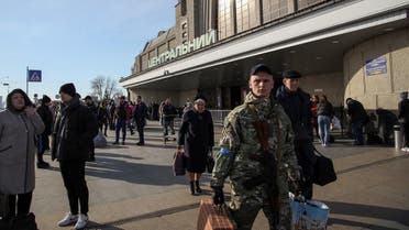 People make their way outside the Kyiv-Pasazhyrskyi railway station, amid Russia’s invasion of Ukraine, in Kyiv, Ukraine, on April 7, 2022. (Reuters)