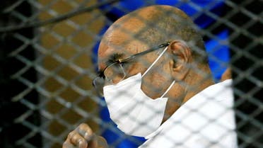 Sudan's ousted President Omar al-Bashir is seen inside the defendant's cage during his and some of his former allies trial over the 1989 military coup that brought the autocrat to power in 1989, at a courthouse in Khartoum, Sudan September 15, 2020. (Reuters)