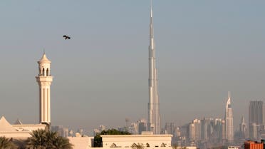 A mosque is seen in front of the world's tallest building Burj Dubai during the Eid al-Adha holiday in Dubai, November 27, 2009. (File photo: Reuters)