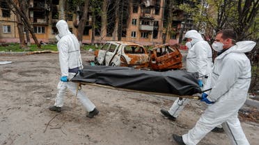  Emergency management specialists transport the body of a person killed during Ukraine-Russia conflict in the southern port city of Mariupol, Ukraine April 21, 2022. (Reuters)