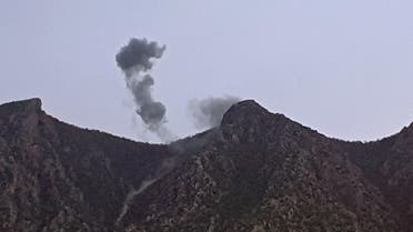 A picture taken on April 19, 2022 shows smoke billowing from behind the mountains of Matin (Jabal Matin) in the town of Chiladze following a Turkish offensive targeting rebels in the northern Iraqi Kurdish autonomous region. (AFP)