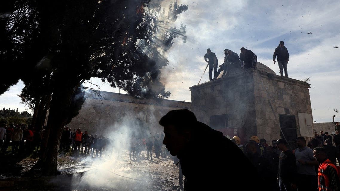 Palestinians put out a fire following a clash with Israeli security forces at the compound that houses Al-Aqsa Mosque, known to Muslims as Noble Sanctuary and to Jews as Temple Mount, in Jerusalem's Old City April 22, 2022. (Reuters)