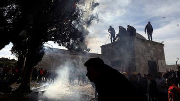 Palestinians put out a fire following a clash with Israeli security forces at the compound that houses Al-Aqsa Mosque, known to Muslims as Noble Sanctuary and to Jews as Temple Mount, in Jerusalem's Old City April 22, 2022. (Reuters)