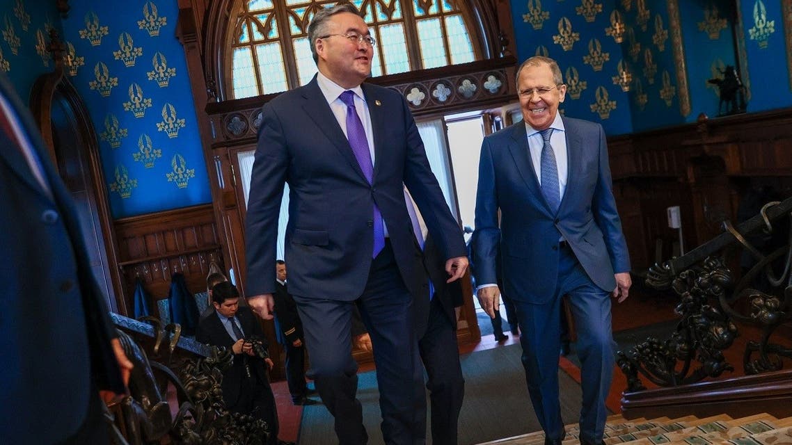 A handout picture taken and released by the Russian Foreign Ministry press service shows Russian Foreign Minister Sergey Lavrov (R) meeting Kazakh Minister of Foreign Affairs Mukhtar Tleuberdi (L) in Moscow on April 22, 2022. (AFP)