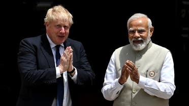 British Prime Minister Boris Johnson and his Indian counterpart Narendra Modi gesture before their meeting at the Hyderabad House in New Delhi, India, April 22, 2022. (Reuters)
