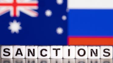 Plastic letters arranged to read Sanctions are placed in front of the flag colors of Australia and Russia in this illustration taken February 28, 2022. (File photo: Reuters)