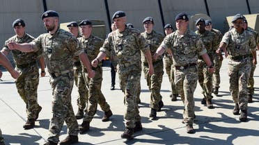Britain's soldiers march after the visit of Britain's Defence Secretary at the Mihail Kogalniceanu Air Base near Constanta, Romania, on April 8, 2022. (AFP)