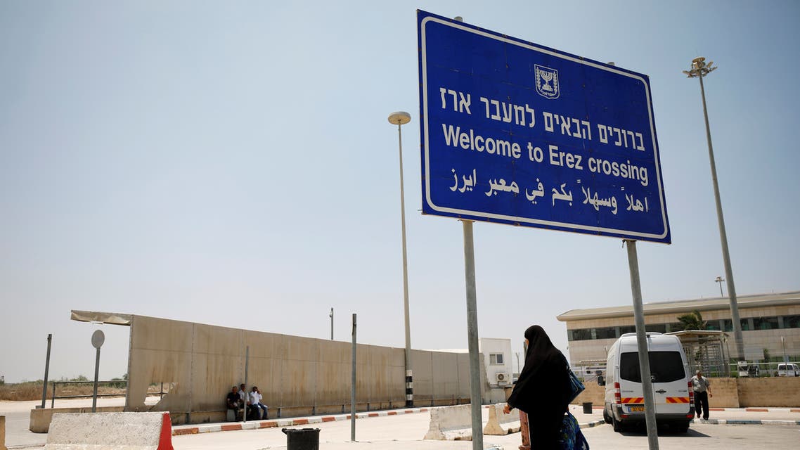 A Palestinian woman stands beneath a sign at the Israeli side of Erez crossing, on the border with Gaza June 23, 2019. (File photo: Reuters)