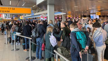 Travellers wait in lines at Amsterdam Schiphol Airport as an unannounced strike of ground staff caused many delays and cancellations, in Amsterdam, Netherlands on April 23, 2022. (Reuters)