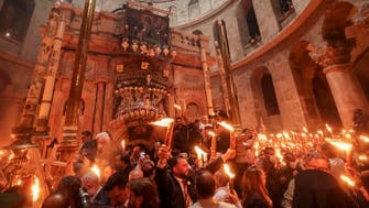 Jerusalem church glows in ‘Holy Fire’ ritual attended by thousands