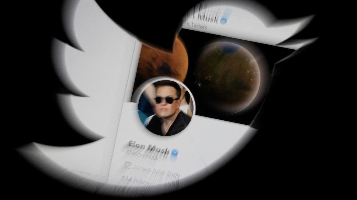 Elon Musk twitter account is seen through Twitter logo in this illustration taken, April 25, 2022. (Reuters)