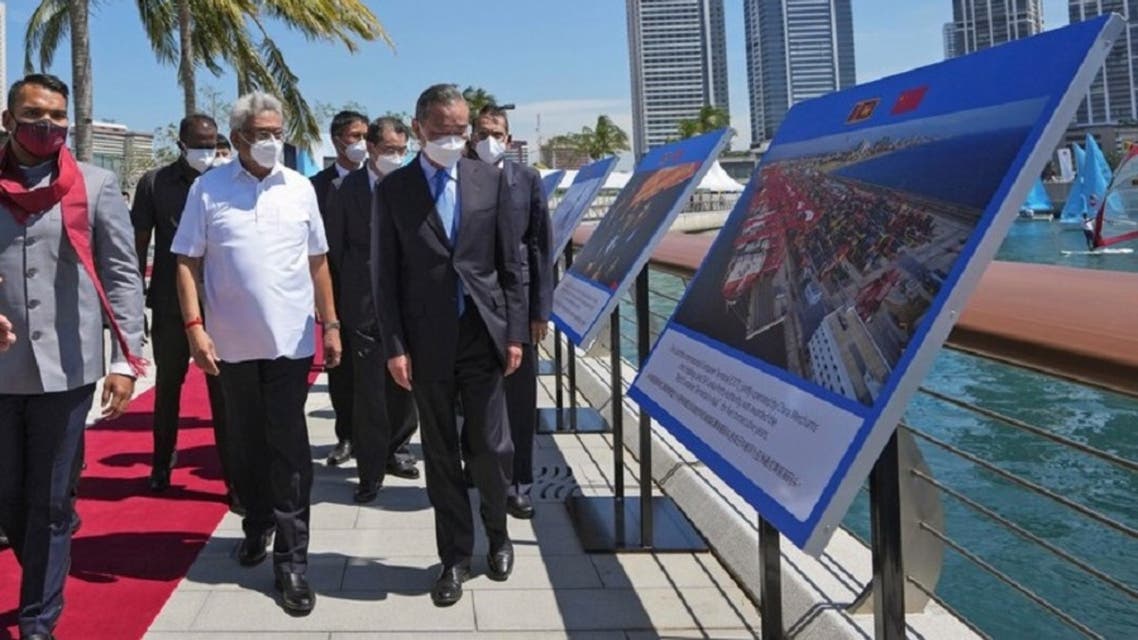 Sri Lankan President Gotabaya Rajapaksa, left, and Chinese Foreign Minister Wang Yi arrive at the Chinese funded sea reclamation Port City project in Colombo, Sri Lanka, on January 9, 2022 .  (AP)