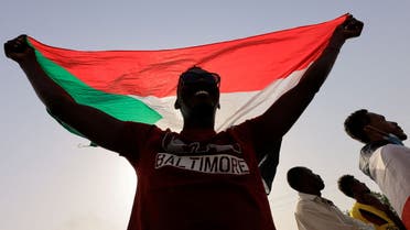 FILE PHOTO: A protester marches during a rally against military rule following coup in Khartoum, Sudan, February 10, 2022. Reuters/Mohamed Nureldin Abdallah/File Photo