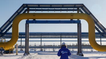 An employee in branded jacket walks past a part of Gazprom's Power Of Siberia gas pipeline at the Atamanskaya compressor station outside the far eastern town of Svobodny, in Amur region, Russia November 29, 2019. (File photo: Reuters)