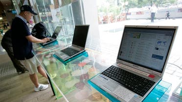 People use computers to surf the internet at the free internet zone for visitors at South Korea's top fixed-line and broadband firm KT Corp in Seoul. (Reuters)