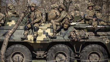 Ukrainian soldiers sit on a armoured military vehicule in the city of Severodonetsk, Donbas region, on April 7, 2022, amid Russia's military invasion launched on Ukraine. (AFP)