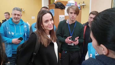 US actor and UNHCR Special Envoy Angelina Jolie listens while meeting with volunteers during a visit to Lviv’s main railway station, amid Russia’s invasion of Ukraine on April 30, 2022 in this still image obtained from handout video. (Reuters)