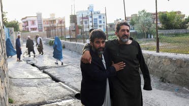 Afghan men flee near the site of explosion at Khalifa Sahib Mosque in Kabul, Afghanistan on April 29, 2022. (Reuters)