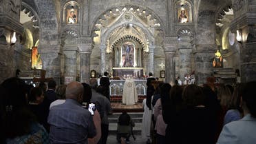 Christian worshipers attend mass at the Syriac Catholic Church of Mar Tuma (Saint Thomas) in Iraq’s northern city of Mosul, on April 30, 2022. (AFP)
