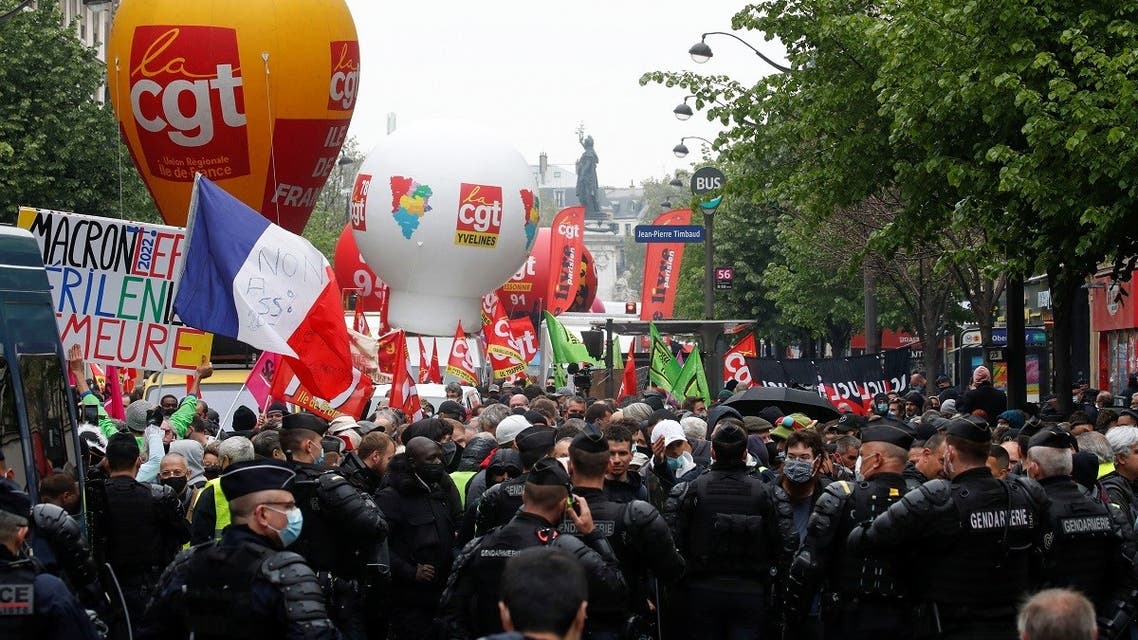 People attend the traditional May Day labor union march, amid the coronavirus disease outbreak in Paris, France, on May 1, 2021. (Reuters) 