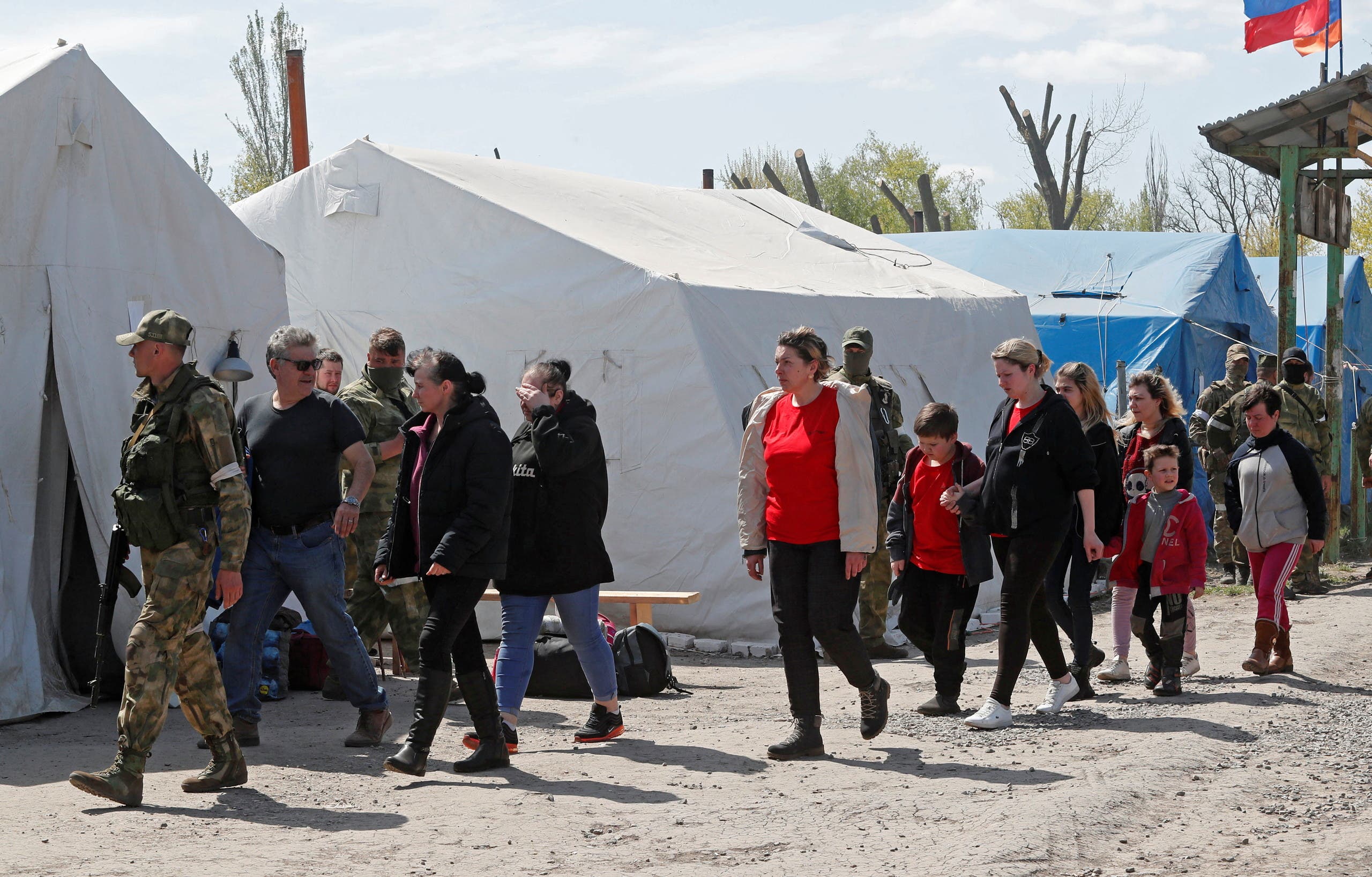 Ukrainian evacuees from a steel mill are living in a temporary shelter in Bizymenoy