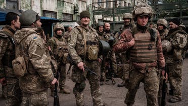 Ukrainian soldiers arrive at an abandoned building to rest and receive medical treatment after fighting on the front line for two months near Kramatorsk, eastern Ukraine, on April 30, 2022. (AFP)