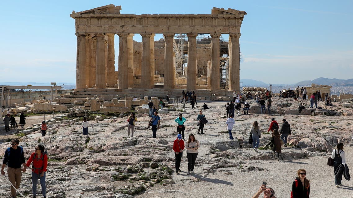 People visit the ancient Parthenon Temple atop the Acropolis hill archaeological site in Athens, Greece, February 26, 2022. Picture taken February 26, 2022. (File photo: Reuters)