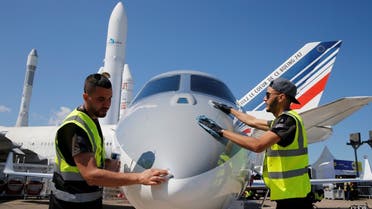 Workers clean up a Gulfstream G280 on static display, before the opening of the 53rd International Paris Air Show at Le Bourget Airport near Paris, France, on June 15 2019. (Reuters)