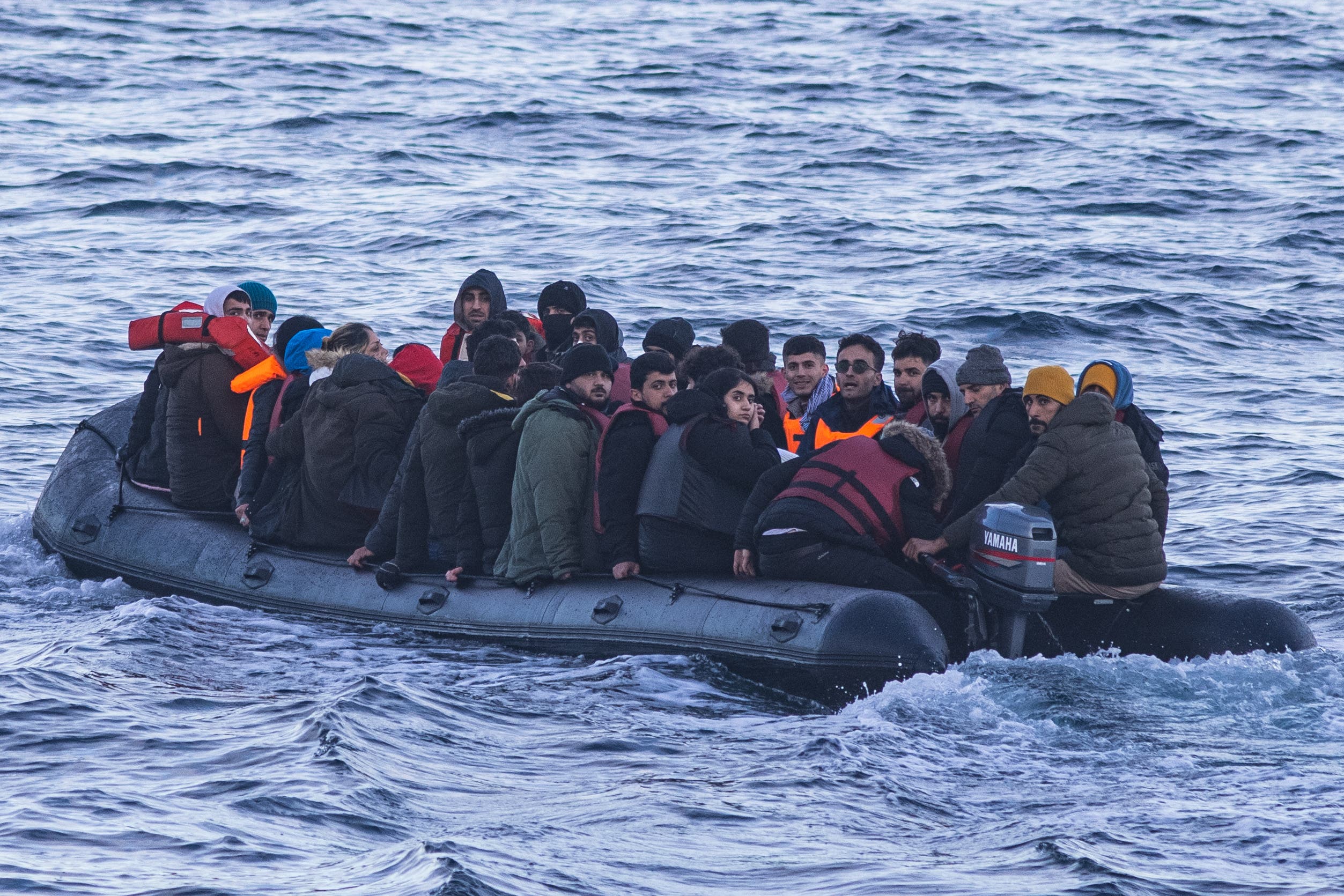Migrants cross the English Channel in small boats last March