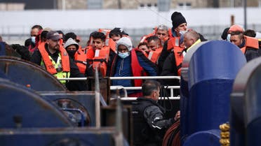 Migrants are escorted in Dover Harbour onboard a Border Force vessel after being rescued while crossing the English Channel, in Dover, Britain, May 1, 2022. REUTERS/Henry Nicholls