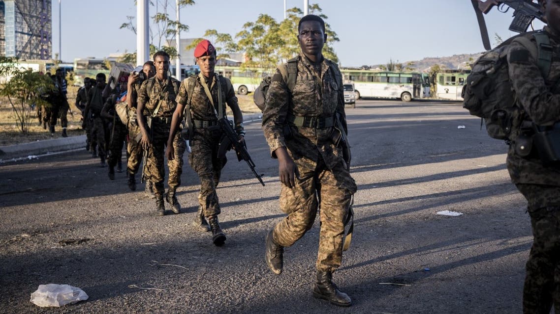 Soldiers from the Ethiopian National Defence Force (ENDF) walk in the streets of Kombolcha, Ethiopia, on December 11, 2021. (AFP)