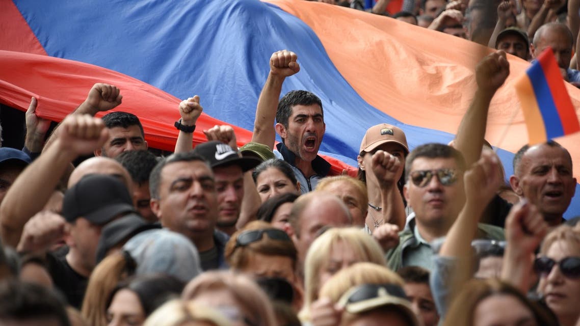 Demonstrators shout slogans as they attend an opposition rally in Yerevan on May 1, 2022, held to protest against Karabakh concessions. (AFP)
