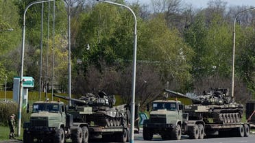 Captured Russian tanks are carried on platforms by the Ukrainian army on a road outside Dnipro, Ukraine, April 30, 2022. (Reuters)