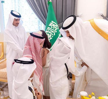 Governor of Al Baha Prince Dr. Hossam bin Saud greets family members of military personnel who lost their lives in service at the start of Eid al-Fitr in Al Baha, Saudi Arabia on May 2, 2022. (SPA)