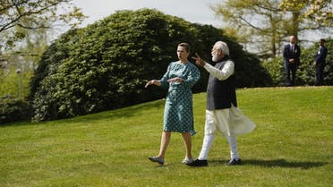 Indian Prime Minister Narendra Modi and Danish Prime Minister Mette Frederiksen walk in the garden at Prime Minister's official residence in Marienborg, in Kongens Lyngby, north of Copenhagen, Denmark May 3, 2022. (Reuters)