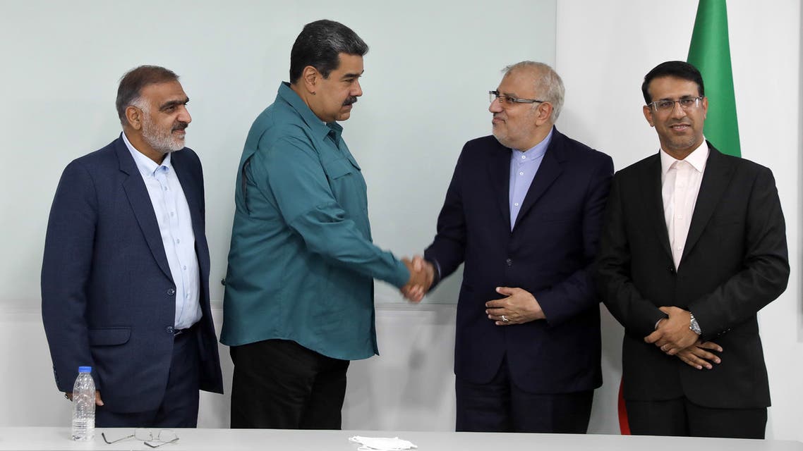 Handout picture released by the Venezuelan Presidency showing Venezuela's President Nicolas Maduro (2-L) shaking hands with Iran's Oil Minister Javad Owji (2-R) during his visit to Miraflores Presidential Palace for a private meeting in Caracas on May 2, 2022. (AFP)
