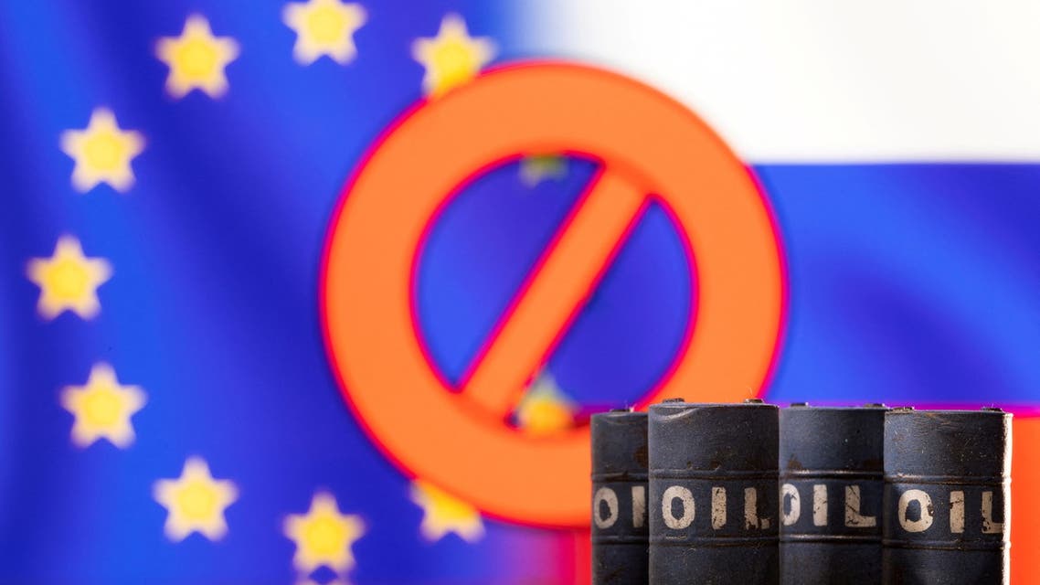 Models of oil barrels are seen in front of the displayed sign stop, EU and Russia flag colors in this illustration taken March 8, 2022. (File Photo: Reuters)