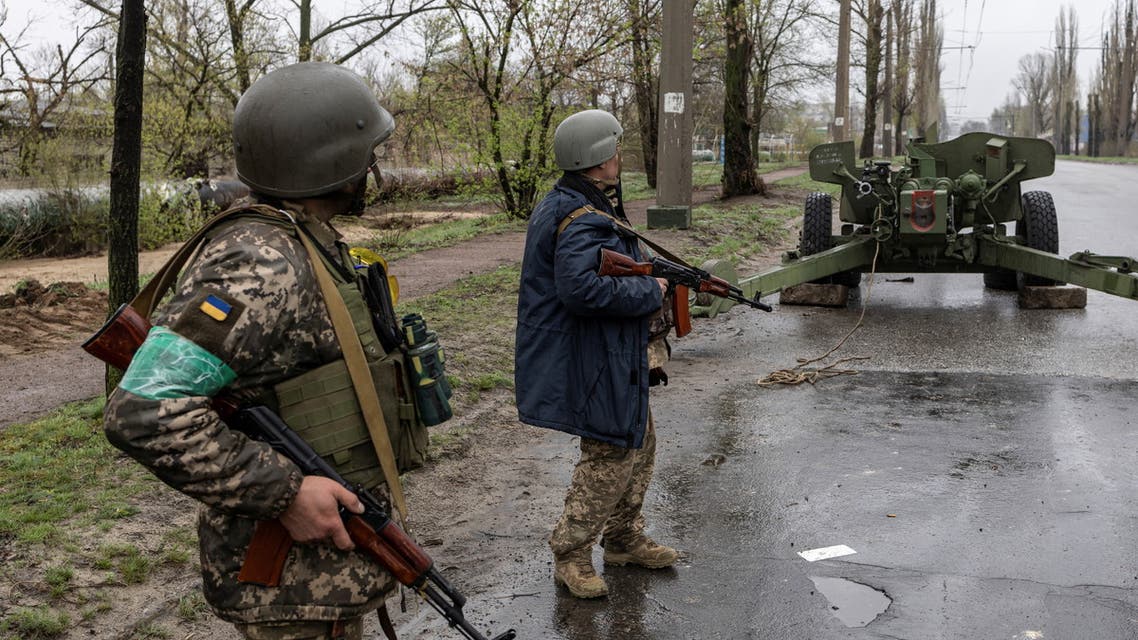 Ukrainian servicemen stand along a road in the town of Severodonetsk, Luhansk region, Ukraine, April 14, 2022. (Reuters)