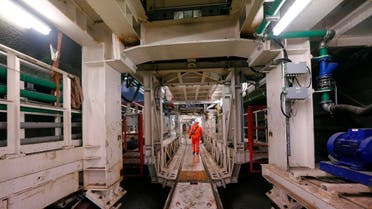 File photo of a worker walking inside a section of a tunnel boring machine in one of the tunnels at Crossrail's Limmo Peninsula site in east London. (Reuters)